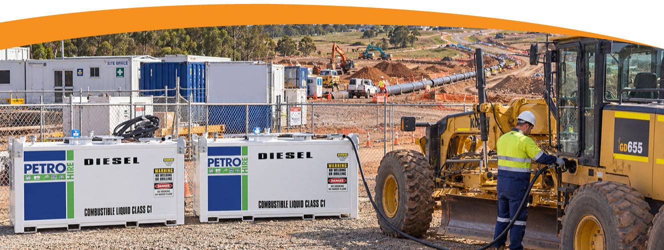 2 x PETRO HIRE Cube fuel storage tanks on a construction site