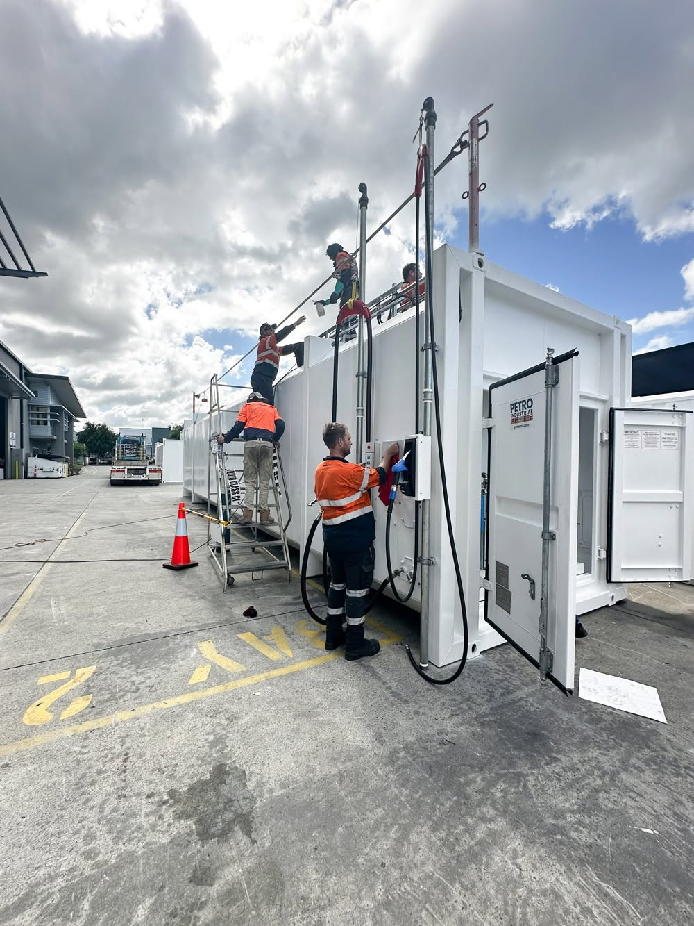 PETRO technicians working on a fuel tank container