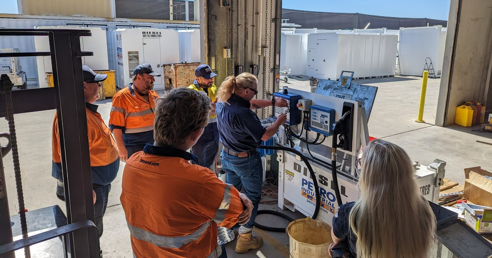 PETRO engineers working on a fuel dispenser control panel