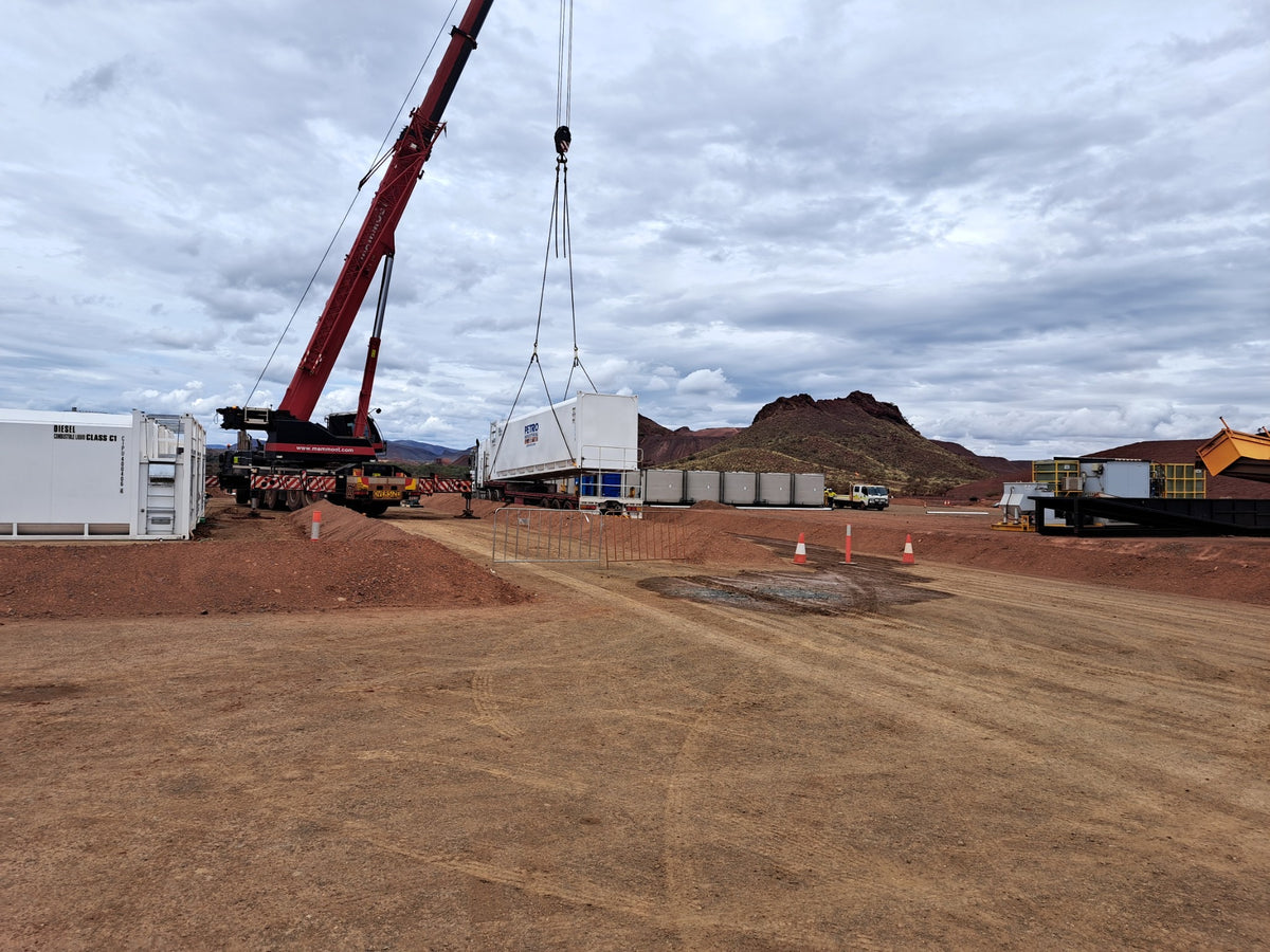 Crane lifting a modular building on a remote Australian site