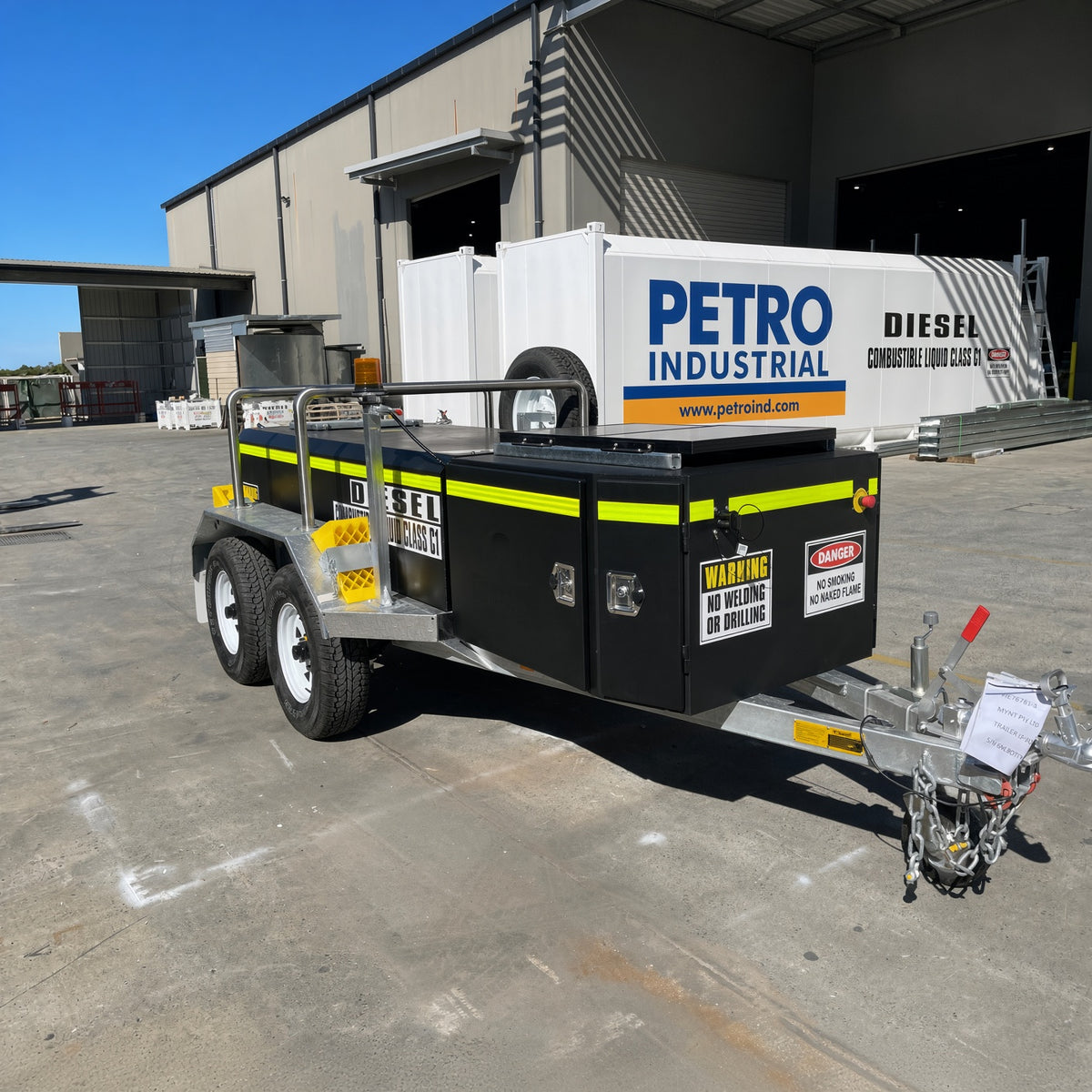 PETRO Industrial diesel transfer trailer parked outside a warehouse