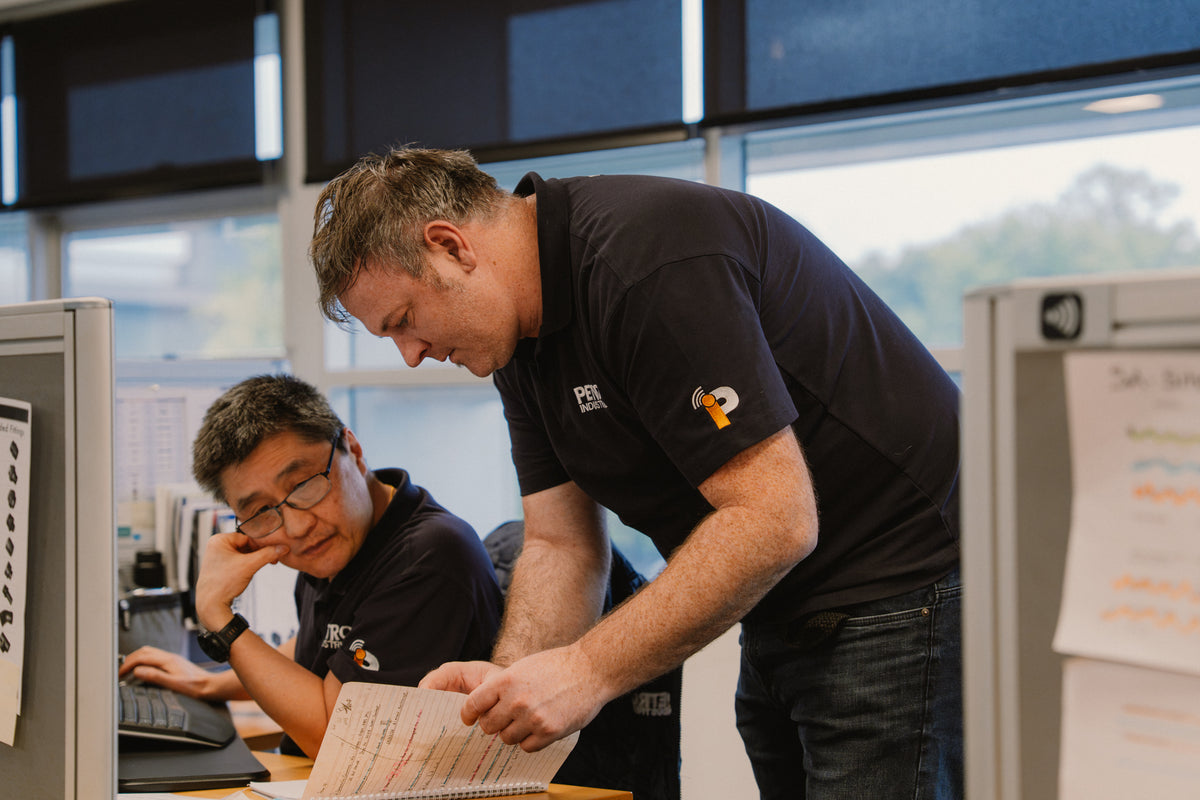 PETRO Industrial team members reviewing quality documentation