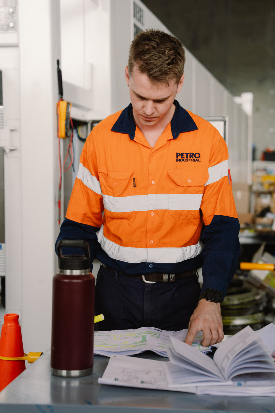 PETRO team member reviewing plans